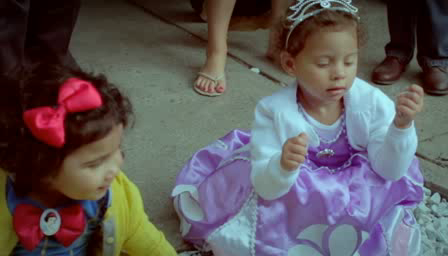 Reference video frame of two children in costume